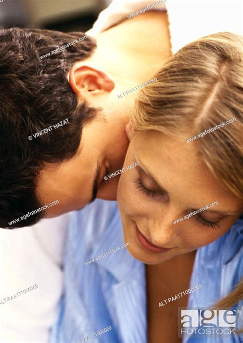 Man Leaning Over Womans Shoulder Kissing Womans Neck Close Up