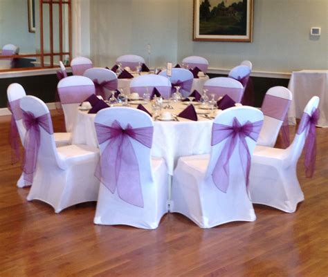 White Stretch Chair Covers And Eggplant Organza Sash