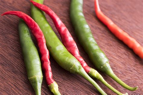 close   fresh red  green hot chilli peppers  stock image