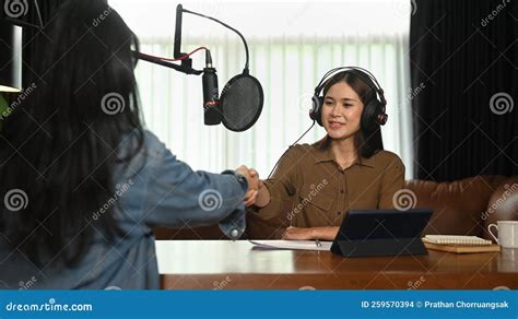 Shot Of Asian Woman Radio Host Shaking Hands With Guest Radio