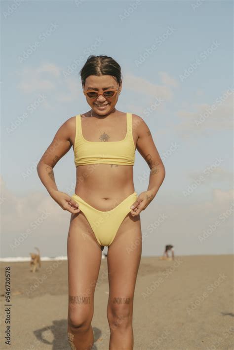 Asian Girl In Bikini At The Beach Standing Stock Photo Adobe Stock