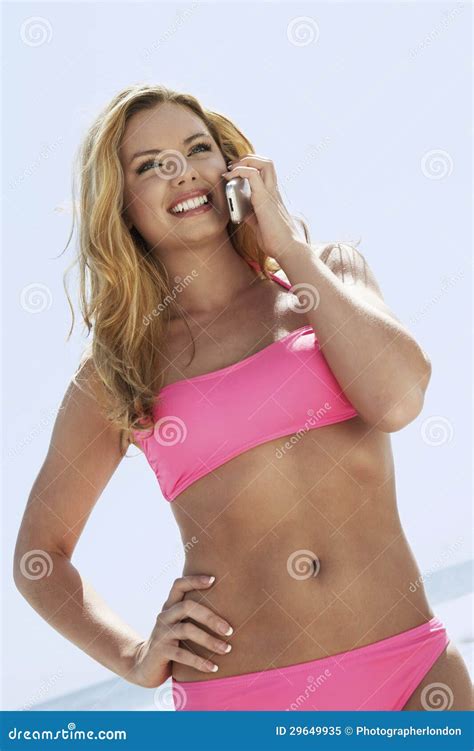 Woman In Bikini Using Cell Phone Stock Image Image Of Leisurely Beauty 29649935