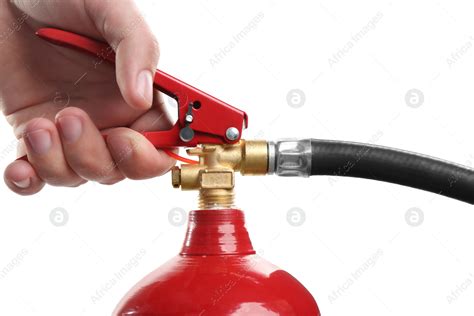 Man Using Fire Extinguisher On White Background Closeup Stock Photo