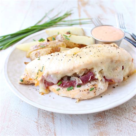 Reuben Chicken Is Tossed With Thousand Island Dressing Stuffed With Sauerkraut And Corned Beef