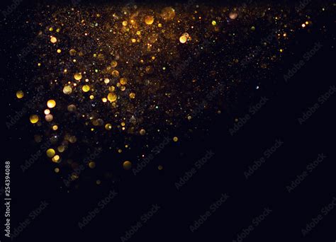 glitter vintage lights background. gold and black. de focused Stock ...