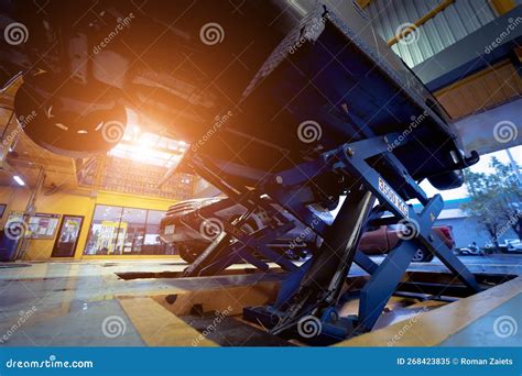 Car on Hydraulic Lift in Auto Repair Shop Stock Image - Image of ...