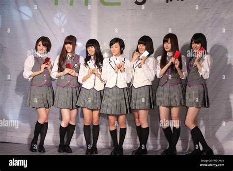 Members of Japanese idol group Nogizaka46 pose during a fans meeting ...