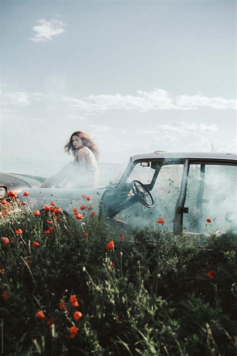 Young Woman In A Poppy Field And Abandoned Car By Stocksy Contributor Jovana Rikalo Stocksy