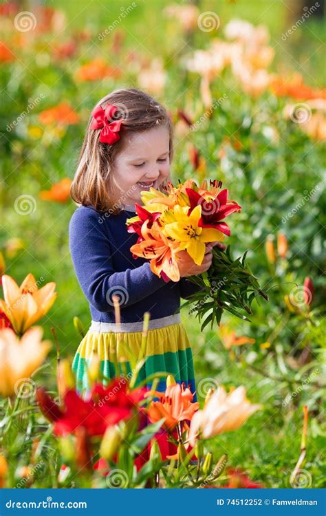 Little Girl Picking Lilly Flowers Stock Photo Image Of Baby Happy