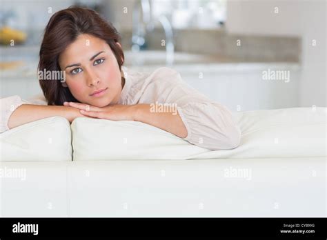 Brunette Relaxing On The Couch Stock Photo Alamy