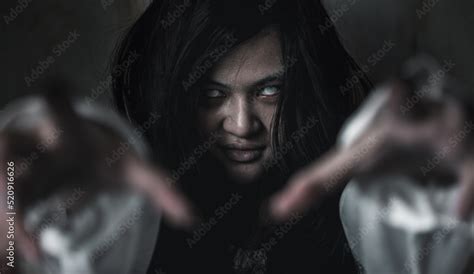 Scary ghost woman. Asian ghost or zombie horror creepy scary have hair covering face and eye ...