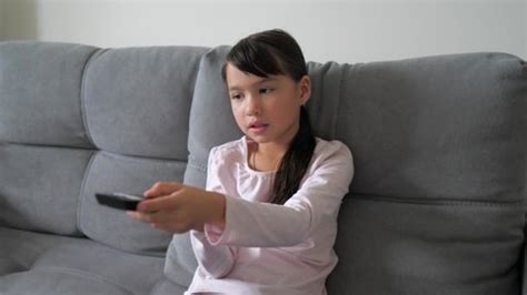 Cute Little Kid Sitting On Couch Stock Footage Video (100% Royalty-free) 1095286967 | Shutterstock