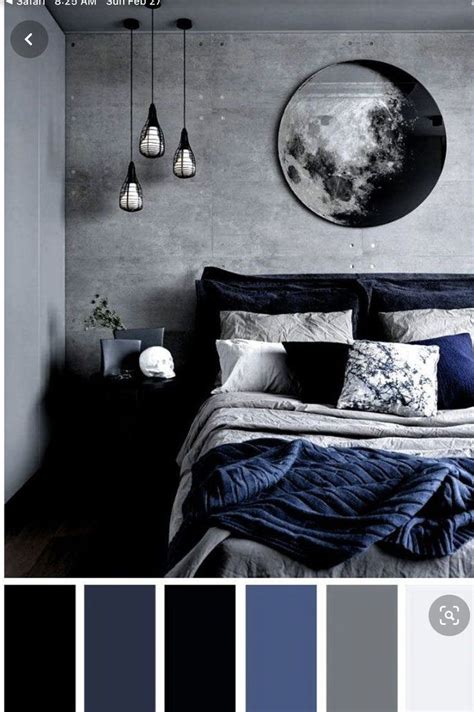 A Bedroom With Grey Walls Blue And White Bedding Black And Gray Decor