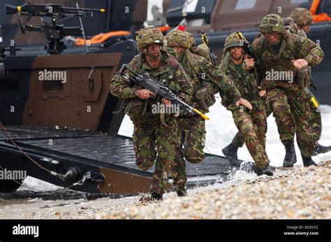 42 Commando Royal Marines Storm The Beach At Browndown Near Lee On