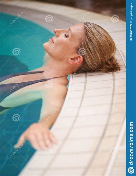 Appreciating The Stillness A Mature Woman Relaxing In An Indoor