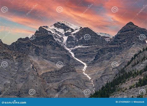 Stunning Sunset Illuminates The Snow Capped Peaks Of Robson Mountain In