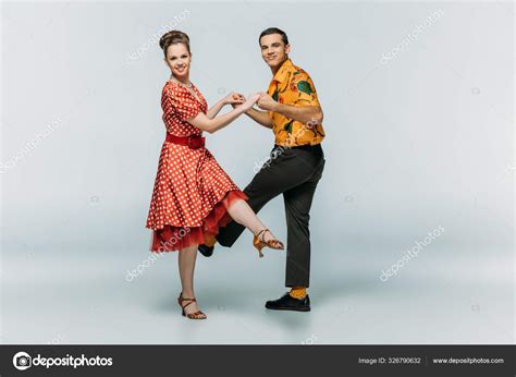 Stylish Dancers Looking Camera While Dancing Boogie Woogie Grey