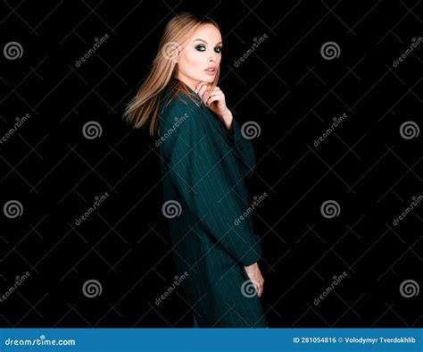 Seductive Woman In Office Suit On Naked Body On Dark Background