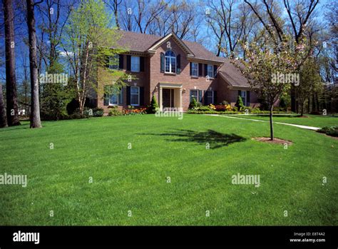 Two story brick house landscaped lawn hi-res stock photography and ...