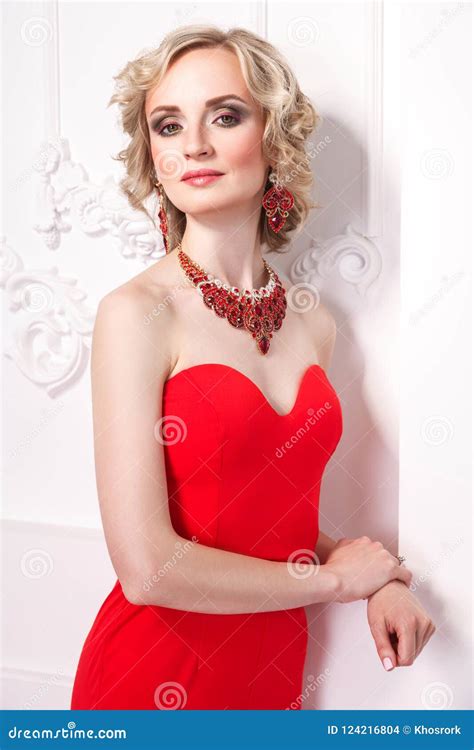 Glamour Blonde Model Posing In Red Dress And Looking At Camera Stock Photo Image Of Adult