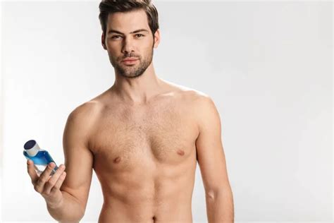 Photo Handsome Half Naked Man Looking Camera Eating Lemon Isolated Stock Photo Vadymvdrobot