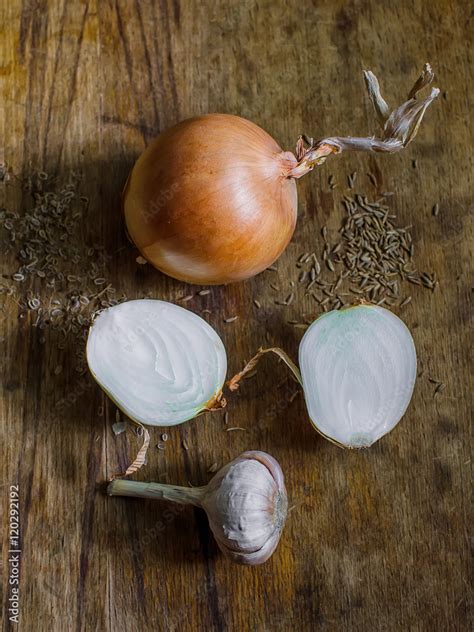 onions and garlic on a wooden table Stock Photo | Adobe Stock