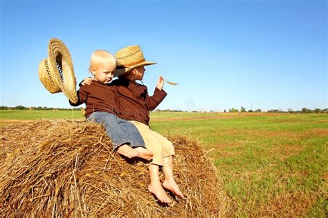 Little Boys Out In The Country On A Hay Bale Royalty Free Stock Photos ...