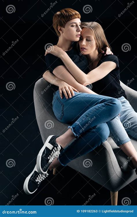 Lesbian Couple Embracing In Armchair Stock Image Image Of Sitting People