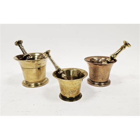 Two 19th Century Brass Pestle And Mortars And A Bell Metal Pestle And Mortar Similar In Sizes Each