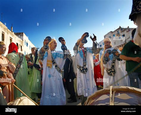 Gnawa musicians on the streets of Essaouira, Morocco durring the festival Stock Photo - Alamy