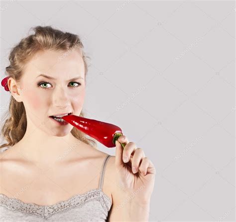 Beautiful Woman Teeth Eating Red Hot Chili Pepper Stock Photo KarynaChe