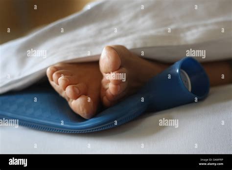 Woman Hot Water Bottle Feet Hi Res Stock Photography And Images Alamy