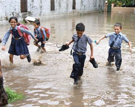 School Children Run For Cover From Rain In Gurgaon India The Hindu