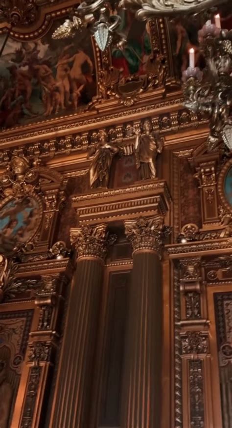 An Ornately Decorated Wall With Clocks And Candles