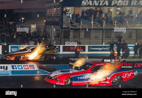 Top fuel funny Car Drag Racing at Santa Pod Raceway. Kevin Chapman Ford Mustang nearside, V ...