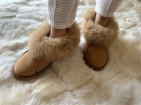 Warm and cozy 100% sheepskin slippers with closed back and fur collar. Crafted from Portuguese ...