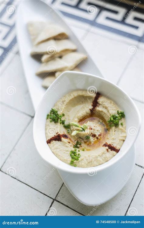 Hummus Or Houmous Appetizer Made Of Mashed Chickpeas Tahini Lemon