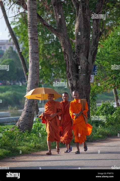 Cambodian Monk Walking In The Street With Umbrella Battambang Province