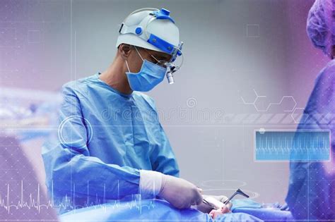 Team Of Professional Doctors Performing Operation In Surgery Room And