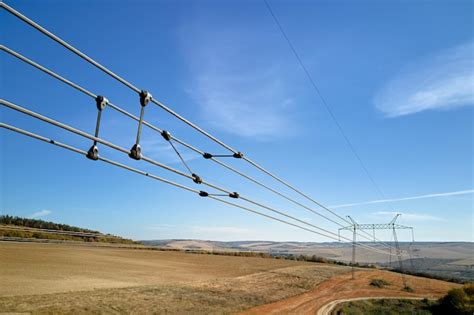 High Voltage Tower With Electric Power Lines Divided By Safe Guard