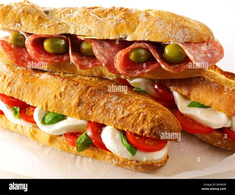 Assorted Baguette Sandwiches Against A White Background Olive And