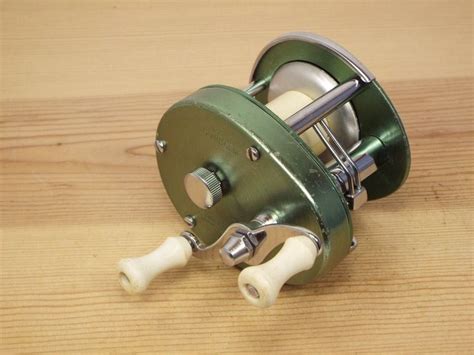 A Fishing Reel On A Wooden Table