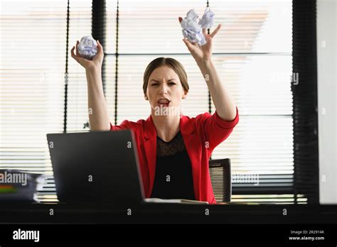 Annoyed Caucasian Woman Throwing Crumpled Papers And Screaming In Anger Feeling Furious