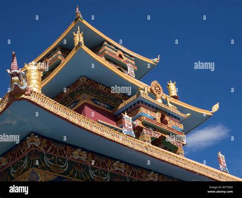 Roof of a Buddhist monastery with traditional Tibetan decorations and ...