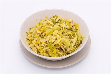 Stir Fried Pickled Mustard Green With Egg In A Bowl On A White Isolated