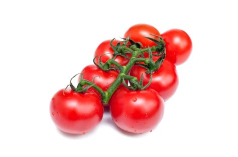 Premium Photo Bunch Of Fresh Red Tomatoes With Green Stems On A White