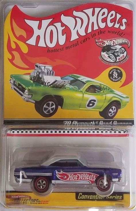 The Hot Wheels Car Is Green And Blue With Flames On It S Hoods