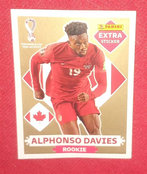 Figurinha Extra Copa Qatar Alphonso Davies De Ouro Rookie Jogador Da