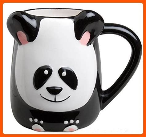 A Black And White Mug With A Panda Bear Face On It S Side Sitting In