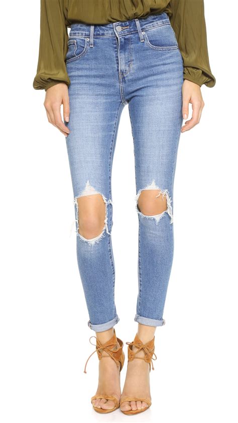 Levis 721 High Rise Distressed Skinny Jeans In Blue Lyst